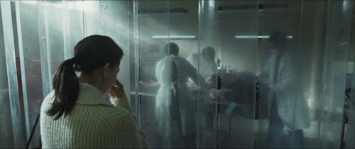 A person standing in a room with a glass wall

AI-generated content may be incorrect.